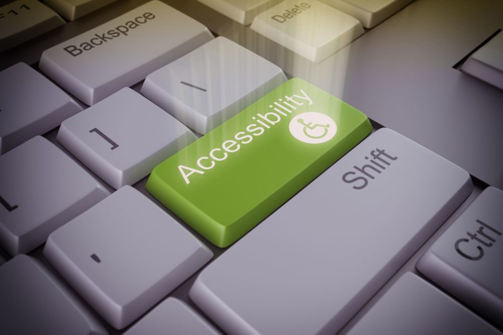 clavier avec une touche verte marqué "acccessibility" pour illustrer l'acessibilité numérique